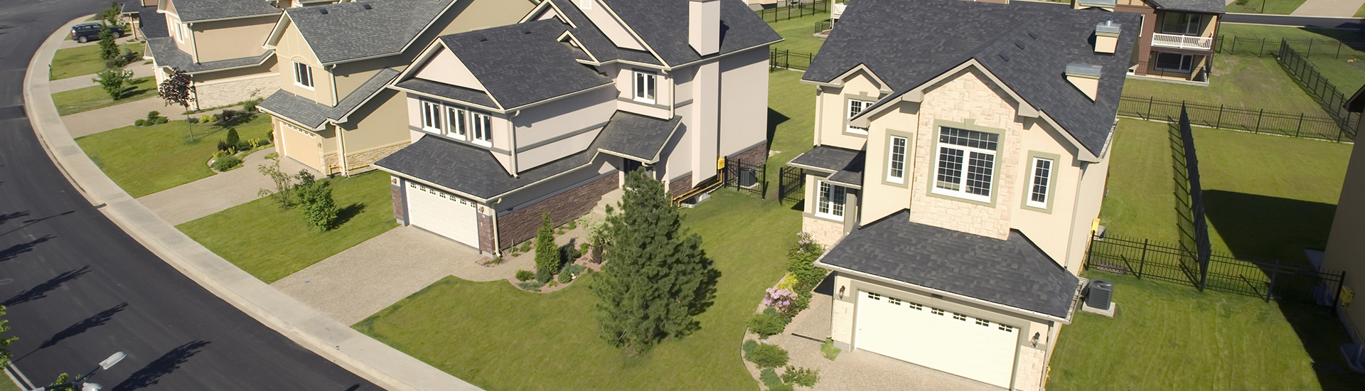 Street of two-story, neutral-colored homes